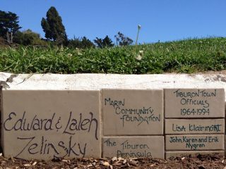Donor names hand-lettered on stoneware tiles